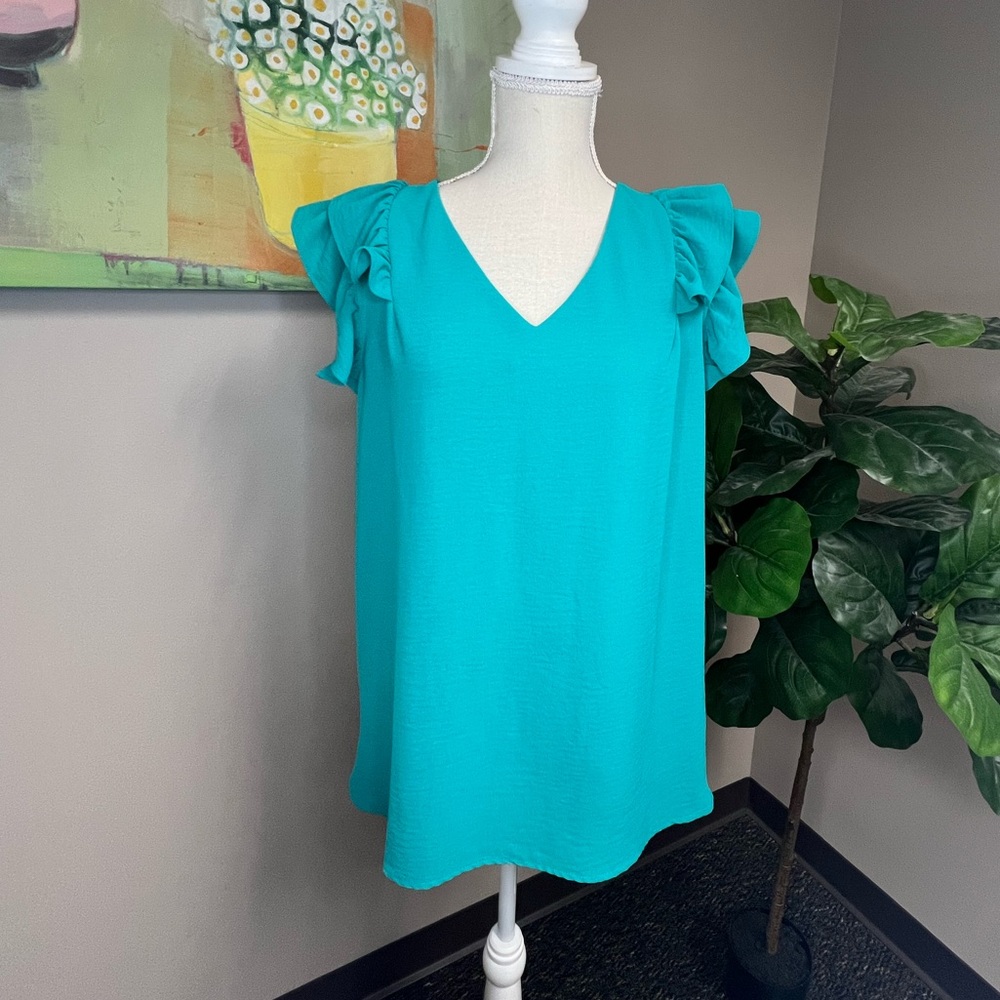NWOT. Turquoise flutter sleeve V-neck blouse. Size XL